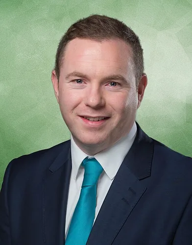 Photo of Chris Hazzard